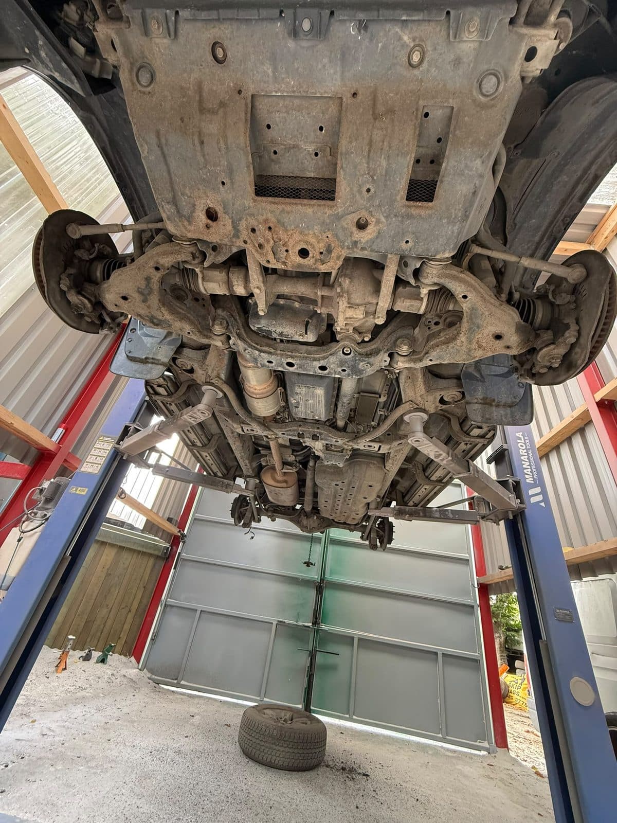4×4 front subframe and floor pan before restoration