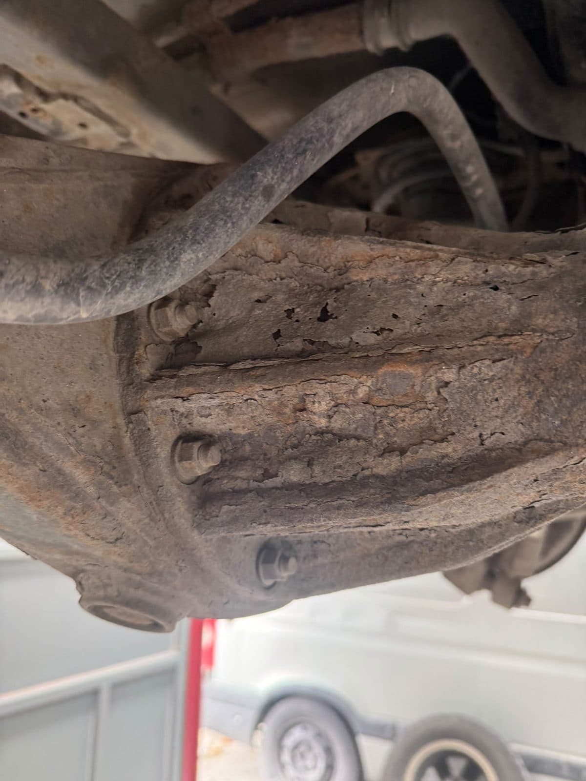 Chassis rail flaking apart around a spring hanger
