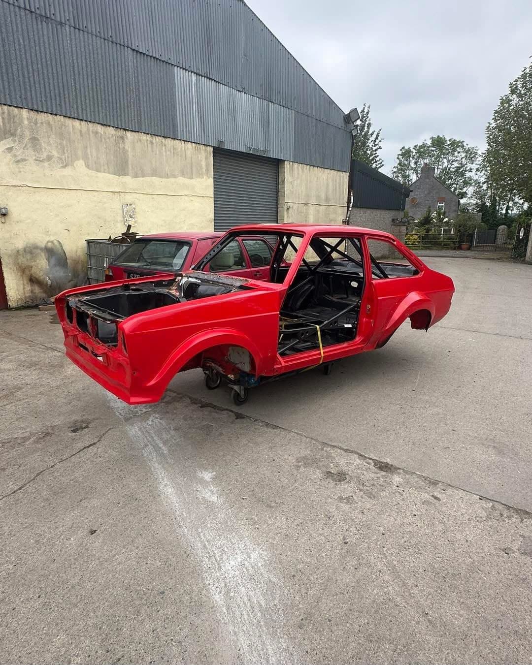 The same Mk2 Ford Escort shell finished in red paint