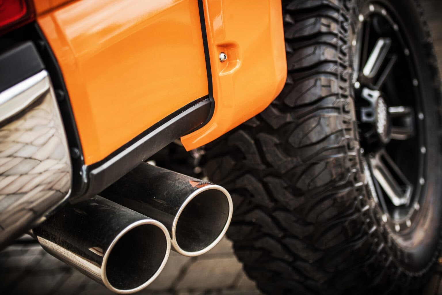 Off-road vehicle wheel and exhaust