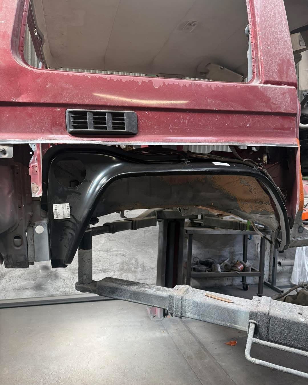 New inner panel beside the original corroded section in a truck cab